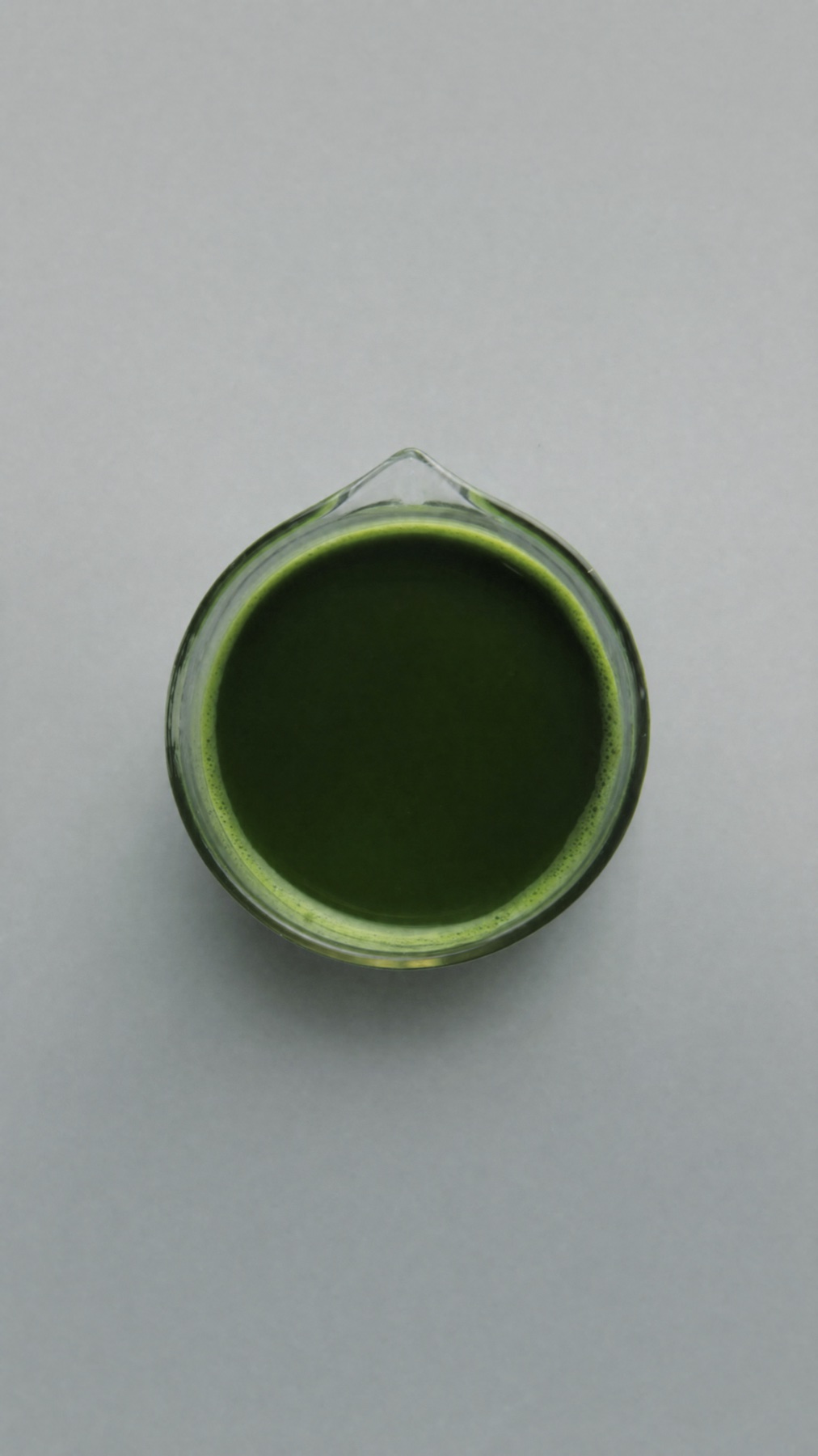 A bowl of bright green matcha powder
